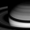Saturn's semitransparent rings arc smoothly around the gas giant, abruptly disappearing where they pass through the planet's shadow are captured in this image from NASA's Cassini spacecraft taken on Apr. 15, 2008.