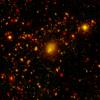 NASA's Spitzer Space Telescope spotted a four-way collision, or merger, in a giant cluster of galaxies, called CL0958+4702, located nearly five billion light-years away. 