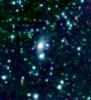 A big galaxy is stealing gas right off the 'back' of its smaller companion in this new image from NASA's Spitzer Space Telescope. The stolen gas is hot, but it might eventually cool down to make new stars and planets. 