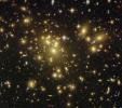 A massive cluster of yellowish galaxies is seemingly caught in a spider web of eerily distorted background galaxies in the left-hand image, taken with the Advanced Camera for Surveys (ACS) aboard NASA's Hubble Space Telescope.