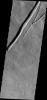 This image from NASA's Mars Odyssey shows the eastern flank of Pavonis Mons on Mars with a large collapse feature and the initiation of a similar feature with small collapses to the east.