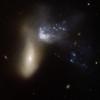 NGC 454 is galaxy pair comprising a large red elliptical galaxy and an irregular gas-rich blue galaxy. This image is part of a large collection of images of merging galaxies taken by NASA's Hubble Space Telescope.