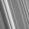 This high-resolution view from NASA's Cassini spacecraft shows, at left, a spiral density wave in Saturn's inner B ring. A spiral density wave is a spiral-shaped massing of particles that tightly winds many times around the planet.