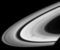 As they wheel about the planet, Saturn's sunlit rings often exhibit dark, radial markings called spokes. This image was captured by NASA's Cassini spacecraft on June 3, 2008.