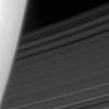 Saturn's C ring emerges from behind the planet's hazy limb in this image captured by NASA's Cassini spacecraft on June 17, 2008.