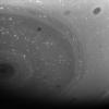 Myriad dark vortices, some large and some small, twirl in the high southern latitudes of Saturn. At left, the south polar vortex spins at the center of it all. This image was taken with NASA's Cassini spacecraft's wide-angle camera on June 23, 2008.