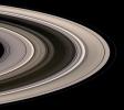 Saturn's icy rings shine in scattered sunlight in this view captured by NASA's Cassini spacecraft shows, looking toward the unilluminated northern side of the rings from above the ringplane. The inner F-ring shepherd moon Prometheus appears at lower left.