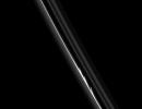 The three bright, finger-like jets of material seen here suggest that a small object has collided with the core of Saturn's F ring. This image was captured by NASA's Cassini spacecraft on Aug. 20, 2008.