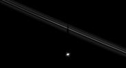 Saturn's moon Pandora casts its shadow upon the F ring. Moon shadows upon the rings will become an increasingly common sight for NASA's Cassini spacecraft as equinox approaches and the Sun moves northward through the ringplane.