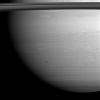 NASA's Cassini spacecraft peers through Saturn's delicate, translucent inner C ring to see the diffuse blue limb of Saturn's atmosphere in this image taken on April 25, 2008.
