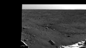 This image zooms in on the backshell and parachute, about 300 meters to the south of NASA's Phoenix Mars Lander. In the distance, about 9 miles or 15 kilometers away, is a range of hills.