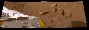 NASA's Phoenix Mars Lander shows its robotic arm took a second scoop full of soil revealing whitish material at the bottom of the dig area informally called the 'Knave of Hearts' on Mars.