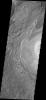 This image from NASA's Mars Odyssey shows textures of the floor material in Crommelin Crater caused by the erosion of a layered deposit within the crater.
