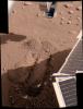 This color image from NASA's Phoenix Mars Lander shows the trench dubbed 'Snow White,' after further digging on June 19, 2008. The lander's solar panel is casting a shadow over a portion of the trench.