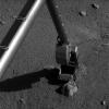 NASA's Phoenix Mars Lander's Robotic Arm comes into contact with a rock informally named 'Alice' near the 'Snow White' trench on Mars. The scoop is seen at the end of the Robotic Arm.