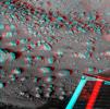 This anaglyph, acquired by NASA's Phoenix Lander's show Phoenix's solar panel is seen in the bottom right corner of the image. 3D glasses are necessary to view this image.
