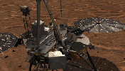 This image shows NASA's Phoenix Lander's Robotic Arm scoop delivering a sample to the Thermal and Evolved-Gas Analyzer (TEGA) and how samples are analyzed within the instrument.
