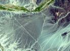 NASA's Terra spacecraft shows the Nasca Lines, located in the Pampa region of Peru, the desolate plain of the Peruvian coast 400 km south of Lima. The Lines were first spotted when commercial airlines began flying across the Peruvian desert in the 1920's.