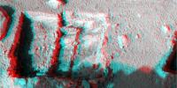 This anaglyph was taken by NASA's Phoenix Mars Lander's Surface Stereo Imager Oct. 7, 2008. The anaglyph highlights the depth of the trench, informally named 'La Mancha,' and reveals the ice layer beneath the soil surface. 3D glasses are necessary.