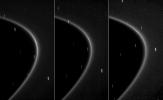 This sequence of three images, obtained by NASA's Cassini spacecraft over the course of about 10 minutes, shows the path of a newly found moonlet in a bright arc of Saturn's faint G ring, taken on Oct. 27, 2008.