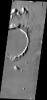 This image from NASA's Mars Odyssey shows the 'tongue' of platy lava located on the eastern side of the crater and spilling towards the north is the margin of an extensive lava field within Amazonis Planitia.