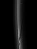 A soft collision between Prometheus and the F ring created the dark channel goring the ring in the bottom of this image from NASA's Cassini spacecraft taken on Feb. 2, 2009.
