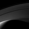 Day breaks on the northern hemisphere of Saturn in this image from NASA's Cassini spacecraft taken on Mar. 20, 2009. The D ring is hidden below the horizon, but, this image shows the C, B, A and F rings.