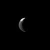 Only a slice of Iapetus is illuminated in this image, but still NASA's Cassini spacecraft spies the distinctive two-tone surface of this distant Saturnian moon taken on Mar. 3, 2009.