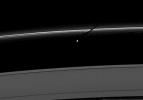The moon Prometheus casts a shadow on the thin F ring marked with streamer-channels created by the moon in this image taken by NASA's Cassini spacecraft as Saturn approaches its August 2009 equinox.