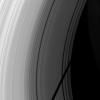 The shadow of Saturn's icy moon Tethys cuts across the C ring in this image taken as Saturn approaches its August 2009 equinox as seen by NASA's Cassini spacecraft.