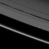 Vertical ring structures created by the moon Daphnis cast dark shadows on Saturn's A ring in this image taken as the planet approached its August 2009 equinox. This image is from NASA's Cassini spacecraft.