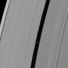 Saturn's moon Pan casts a longer shadow across the A ring as the planet's August 2009 equinox draws near. This image is from NASA's Cassini spacecraft.