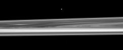 Orbiting near the plane of Saturn's rings, NASA's Cassini spacecraft looks across the span of the rings to spy the small moon Epimetheus. The brightest spoke is visible on the left of the image.
