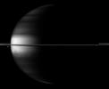 Dramatic differences between dark and light embellish image of Saturn, its rings and its moons Dione and Enceladus in this image taken by NASA's Cassini spacecraft.