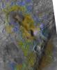 The color coding on this CRISM composite image of an area on Mars is based on infrared spectral information interpreted as evidence of various minerals present. Carbonate, which is indicative of a wet and non-acidic history, occurs in very small patches.