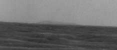 A high point on the distant eastern rim of Endeavour Crater is visible on the horizon of this image taken by NASA's Mars Exploration Rover Opportunity on March 8, 2009.