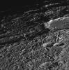 NASA's Mariner 10 shows a close-up view of craters Vyasa and Stravinsky on Mercury. Stravinsky is a smooth-floored crater partially seen overlying the rim of the larger, rougher crater Vyasa in the center and left.