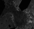 This mosaic of image swaths from NASA's Cassini's Titan Radar Mapper, taken with the synthetic-aperture radar, features a large dark region several hundred kilometers across that differs in several significant ways from potential lakes observed on Titan.