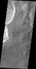 The dark slope streaks in this image are located on the rim of an unnamed crater east of Schiaparelli Crater taken by NASA's 2001 Mars Odyssey spacecraft.