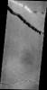 This NASA 2001 Mars Odyssey spacecraft image shows two different types of linear depressions. The wide depression at the top of the frame is Elysium Fossae, which most likely formed due to tectonic activity.