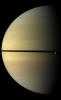 Saturn, stately and resplendent in this natural color view taken by NASA's Cassini spacecraft, dwarfs the icy moon Rhea. Rhea orbits beyond the rings on the right of the image. Tethys shadow is visible on the planet on the left of the image.