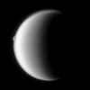 Rhea emerges after being occulted by the larger moon Titan in this image taken by NASA's Cassini spacecraft.
