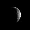 NASA's Cassini spacecraft looks toward a crescent of Saturn's dark and light moon, Iapetus.