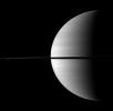 Rhea and Enceladus appear above and below the rings on the left of this image, serving to visually offset the dominance of Saturn in this image taken by NASA's Cassini spacecraft.