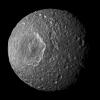 Relatively dark regions below bright crater walls and streaks on some of the walls are seen in this mosaic of Saturn's moon Mimas, created from images taken by NASA's Cassini spacecraft during its closest flyby of the moon.
