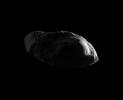 Appearing like eyes on a potato, craters cover the dimly lit surface of the moon Prometheus in this high-resolution image from NASA's Cassini spacecraft's early 2010 flyby.