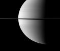 Resembling ornaments hanging from Saturn's rings, two moons accent this portrait of the planet captured by NASA's Cassini spacecraft. The moon Enceladus is on the right. Dione is on the left.
