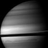 Huge clouds swirl through the southern latitudes of Saturn where the rings cast dramatic shadows. This view from NASA's Cassini spacecraft looks toward the northern, sunlit side of the rings from just above the ringplane.