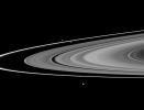 The F ring's shepherds, Prometheus and Pandora, join Epimetheus in this image taken by NASA's Cassini spacecraft of three of Saturn's moons and the rings.