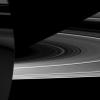 Capturing the interplay between light and shadow, NASA's Cassini spacecraft looks toward the night side of Saturn where sunlight reflected off the rings has dimly illuminated what would otherwise be the dark side of the planet.